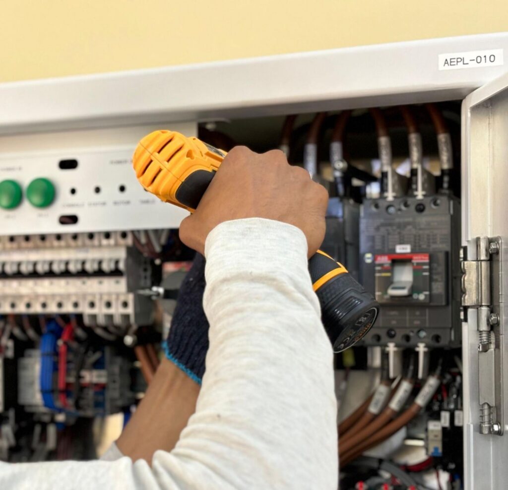 A licensed electrician from All 4 You Electrical tests an electrical panel to help a home stay ready for Boise, ID power outages.